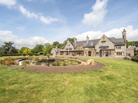A large house with a pond and garden at Harcombe House Rooms - First Floor Twin, Chudleigh