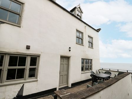 An outdoor area with a table and chairs at Shelstone in Whitby