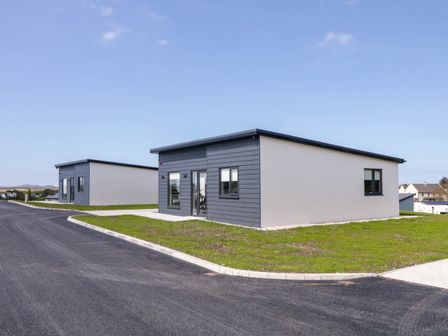 Two single story modern houses with paved driveways and grass lawns at Number 2 Villa - The View in Derrybeg County Donegal