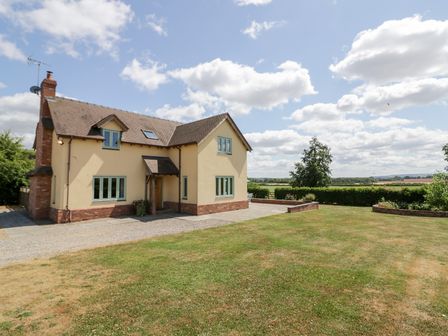 A house with a driveway and garden at Filly Brook in Bishop's Frome