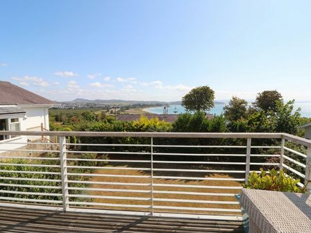 An outdoor area with a coastal view at Machroes Cottage near Bwlchtocyn near Abersoch