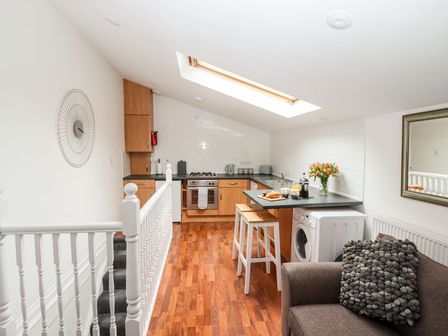 A kitchen with appliances and furnishings at Bobby's in Whitby