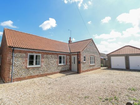 A house with a garage and front yard at Woodlark in 