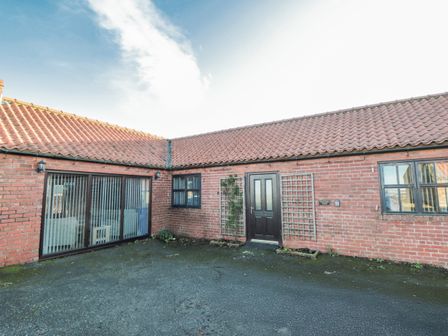 An outdoor area with a door and windows at Pasture View in