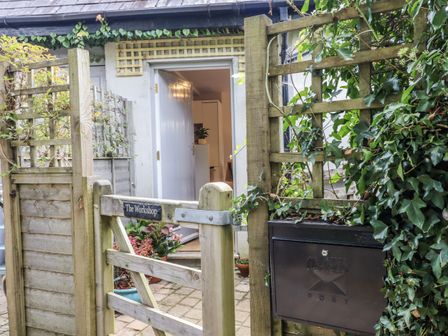 An entrance gate and door leading to The Workshop in Mary Tavy