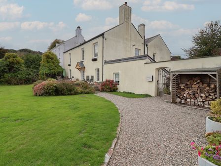 A house with a garden and pathway at The Old Manor House in Lifton