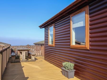 An outdoor space with a table and chairs at Ocean Terrace 28 Mullacott Ilfracombe