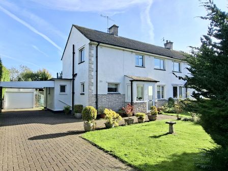 A house with a carport and garden at Apple Byrd in Kendal