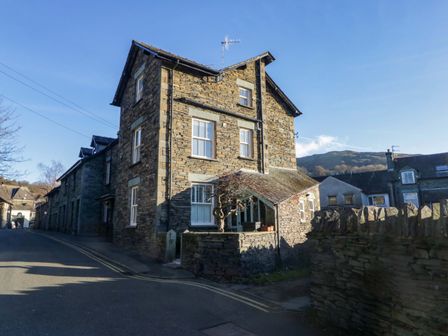 A stone building with windows and a door at Park View in Ambleside