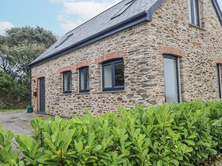 A house with windows and a door at Barn 2