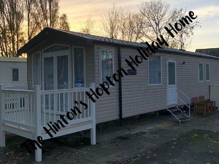 a holiday home with a front porch and steps at Hopton Holiday Village - Holiday Accommodation 10129 in Hopton