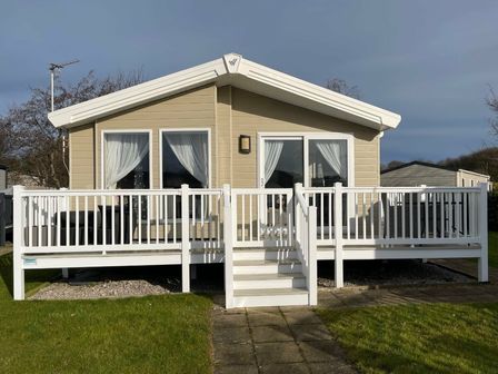 a holiday home exterior with a deck and steps at Cala Gran Holiday Park - Holiday Accommodation 10898 Fleetwood