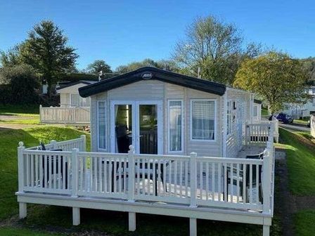a holiday home with a deck and white railings at Hoburne Devon Bay - Holiday Accommodation 13932 in Paignton