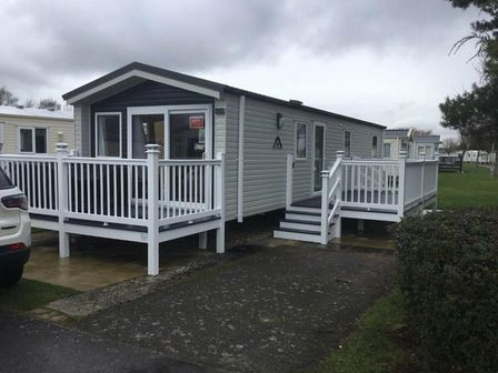 a holiday home with a deck and steps at Butlins Skegness - Holiday Accommodation 14276 in Skegness