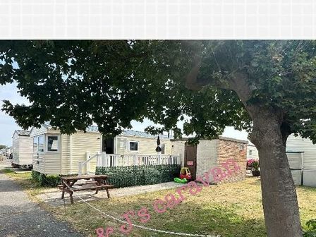 a caravan park with caravans and a picnic table at Lyons Winkups and Primrose - Holiday Accommodation 14301 Towyn