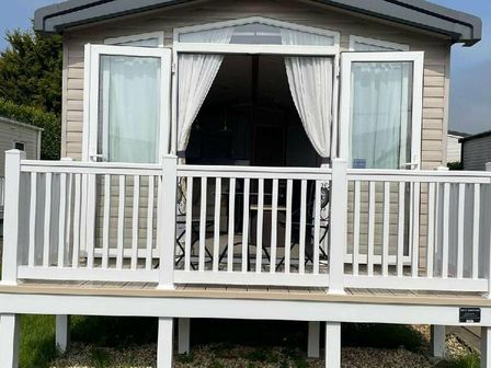 a holiday home with a porch and chairs at Weymouth Bay Holiday Park - Holiday Accommodation 15002 in Weymouth
