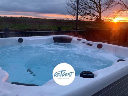 a hot tub with water bubbles and a sunset view at Patrington Haven Leisure Park - Holiday Accommodation 15130 in Patrington