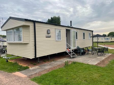 a mobile home with steps and outdoor seating at Butlins Minehead - Holiday Accommodation 15528, Minehead