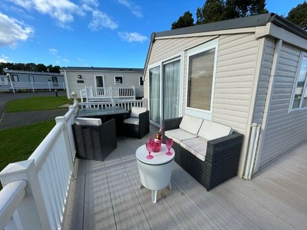 a patio area with seating and a table at Cayton Bay Caravan Park - Holiday Accommodation 17038, Scarborough