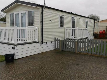 a caravan with a porch and fencing at Patrington Haven Leisure Park - Holiday Accommodation 17157 in Patrington