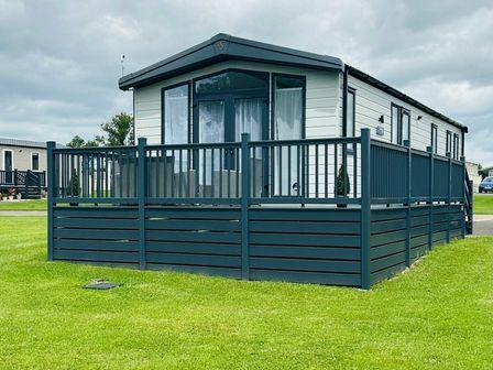 a holiday home with a deck and lawn area at Ashbourne Heights Holiday Park - Holiday Accommodation 18103 in Ashbourne