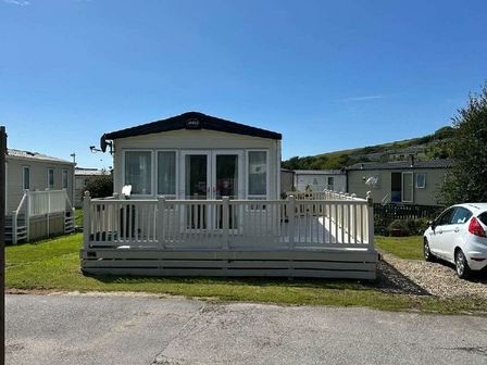 a holiday home with a deck at Challaborough Bay Holiday Park - Holiday Accommodation 18814 in Kingsbridge