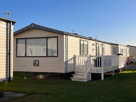 a static caravan with a porch and steps at Lyons Robin Hood - Holiday Accommodation 20245, Rhyl