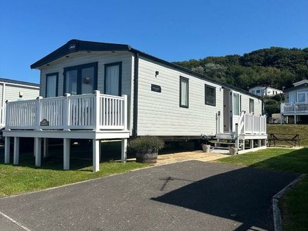 a holiday home on stilts with a deck and walkway at Littlesea Holiday Park - Holiday Accommodation 20746 Wells