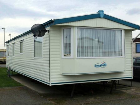 a mobile home with light exterior and large windows at Edwards Leisure Park - Holiday Accommodation 20813 in Abergele