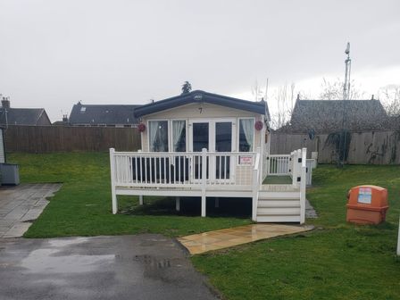 A holiday home with a deck at Marton Mere Holiday Village - Holiday Accommodation 20877 Blackpool