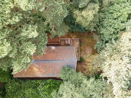 an aerial view of a house surrounded by trees at Kelling Heath Holiday Park - Holiday Accommodation 20952 Weybourne