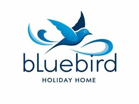 a logo featuring a blue bird and the text Bluebird Holiday Home