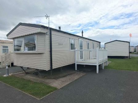 a holiday home with a deck and antenna at Golden Sands Kinmel Bay - Holiday Accommodation 22191 in Kinmel Bay
