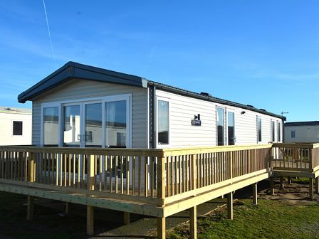 A mobile home with a deck at Perran Sands - Holiday Accommodation 4301 Perranporth