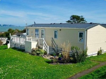 a holiday home with a deck and garden area at Waterside, Paignton - Holiday Accommodation 663, Paignton