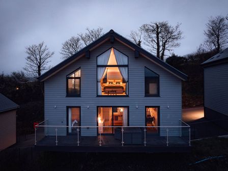 A house with windows and a balcony at Ferry Hills in Laugharne