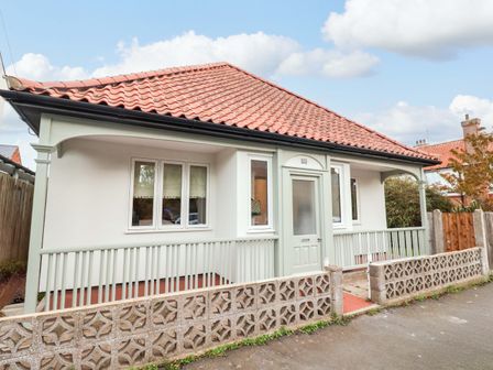 A house with a porch and windows at 52 Lee Road in Aldeburgh