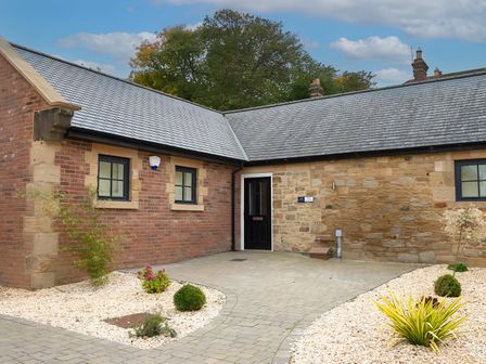 A building exterior with a door and windows at The Shearling in Morpeth
