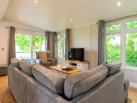 A living room with a sofa and television at Bainbridge in Leyburn