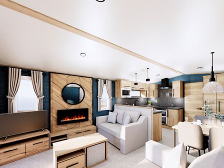 A living room with a sofa, tv, and coffee table at Willow Spa in Carlton Miniott near Thirsk