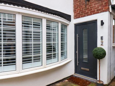 A front entrance with a door and windows at OG's House in Whitby