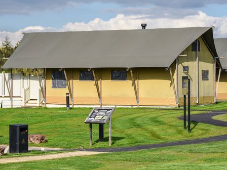A tent with a pathway and sign at Savannah (Pet) Penrith