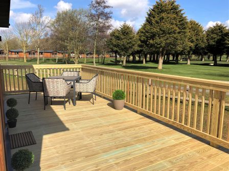 A deck with a table and chairs at Dream View in Waltham