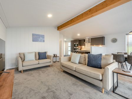 A living room with sofas and a coffee table at Sonnet 3 Spa (Pet) Laugharne