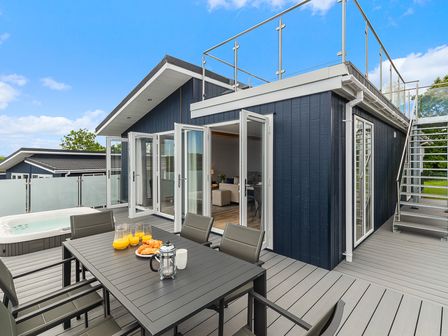An outdoor terrace with a table and chairs at Sonnet 3 Roof Terrace Spa in Laugharne