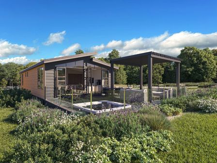 A house with a deck and swimming pool in a garden at Fell Side Penrith