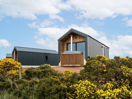 Two houses with a wooden hot tub in the outdoor area at The Grays in North Berwick