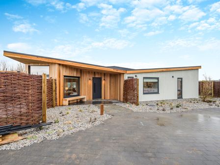 A house with an entrance and driveway at Trelowen 2.0 Spa in Marhamchurch
