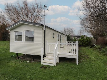 A mobile home with a staircase and railing at Willerby Ellerrton (delyn)