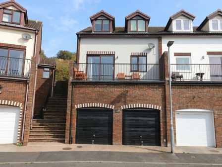 A house with garages and balcony at Upper Longlands in Dawlish
